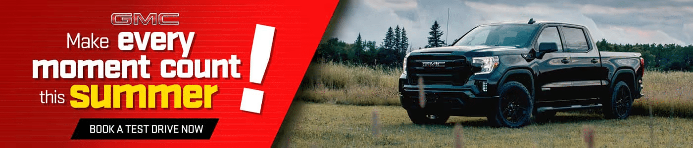 GMC truck in a grassy field with "Make every moment count this summer" slogan, urging test drives.