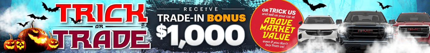 Halloween-themed car trade-in promotion offers $1,000 bonus amidst spooky pumpkins and bats.