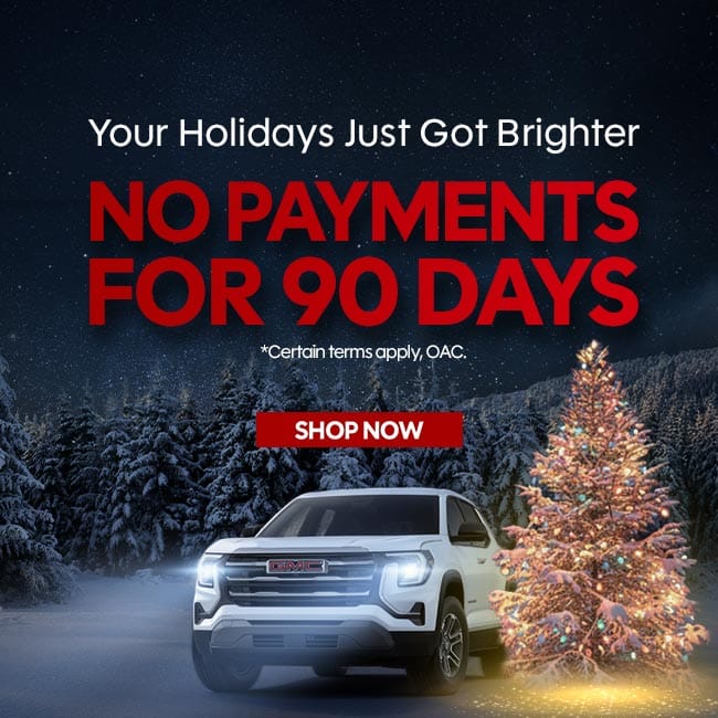 Holiday car promotion: "No Payments for 90 Days" with a white truck and a decorated Christmas tree.